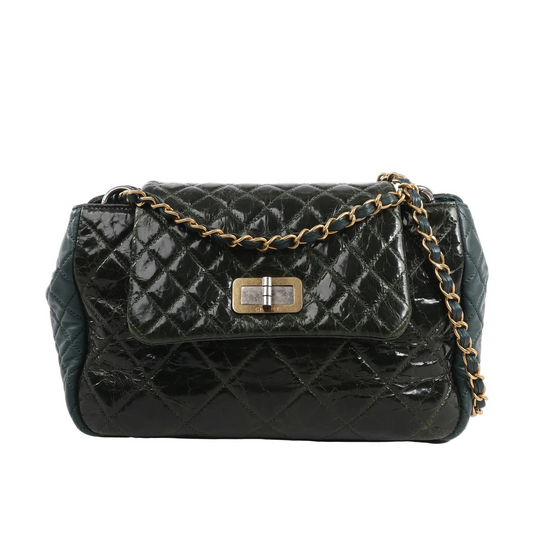 Chanel Reissue Accordion Shoulder Bag in green quilted leather mix with flap closure, aged gold-tone chain and turn-lock clasp, displayed against a white background.