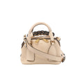 Front view of Chloé Dahlia beige leather handbag with a rounded top handle, contrasting braided handle, gold-tone zip pulls and a shoulder strap.