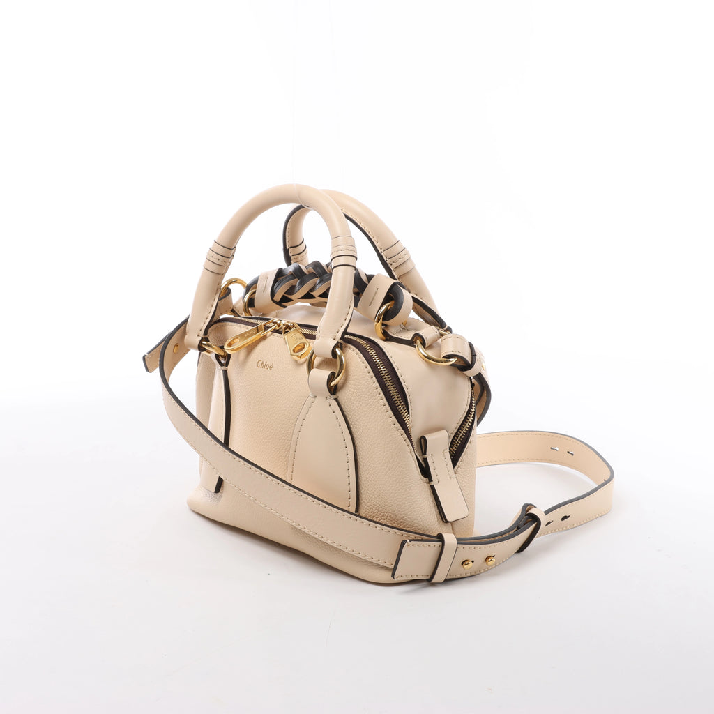 Bolso Chloé Woody Small de lona y piel bicolor en beige y azul