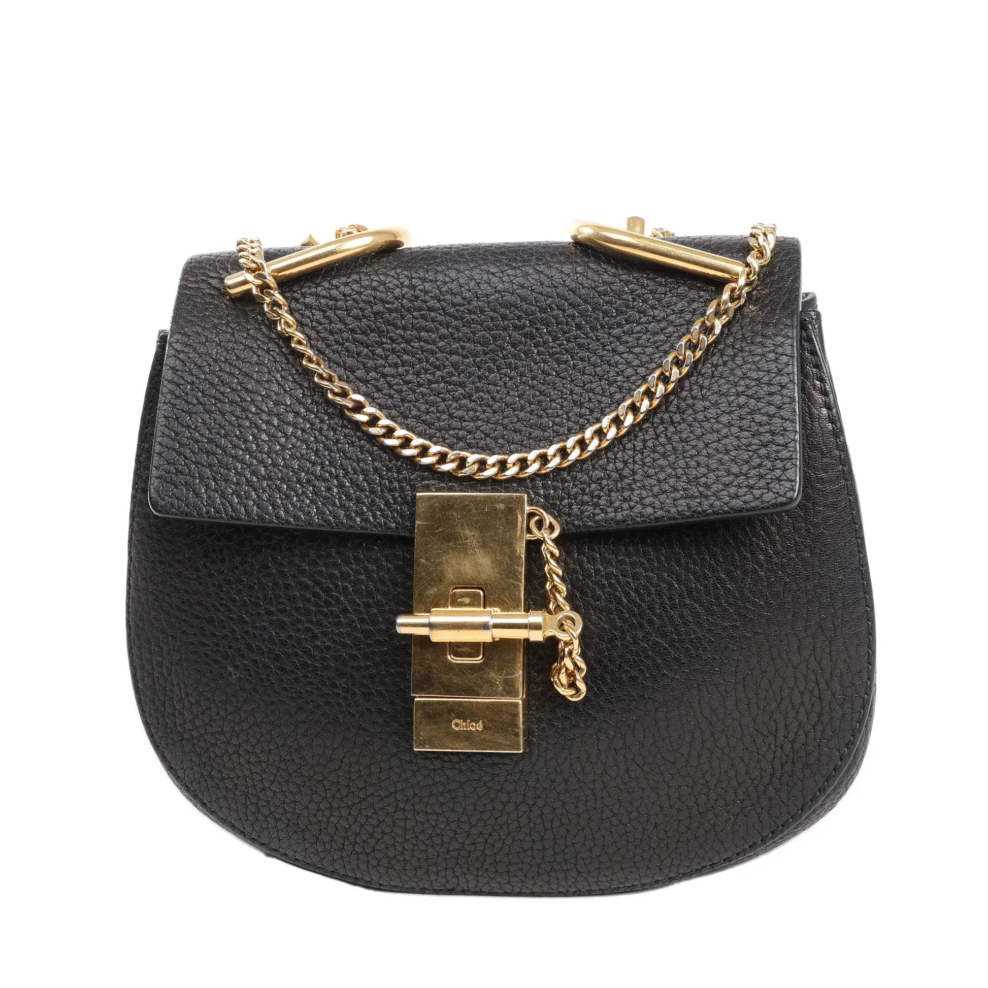 Chloé Drew shoulder bag in black pebbled leather with gold-tone chain strap, front flap, and signature turn-lock closure.