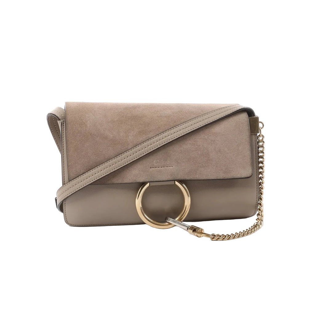 Beige Chloé Faye crossbody bag with suede flap, smooth leather base, large gold ring hardware, and gold chain strap detail.