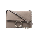 Beige Chloé Faye shoulder bag with suede flap, smooth leather body, adjustable leather strap, gold-tone ring and chain hardware.