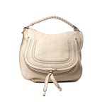 Chloé Marcie beige leather hobo handbag with wrapped top handle, curved stitched front flap, tie detail, and gold-tone hardware on white background