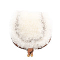 Chloé Marcie Mini Crossbody Bag in brown leather with a fluffy white boa shearling flap, curved saddle shape, and thin adjustable shoulder strap, shown against a white background.
