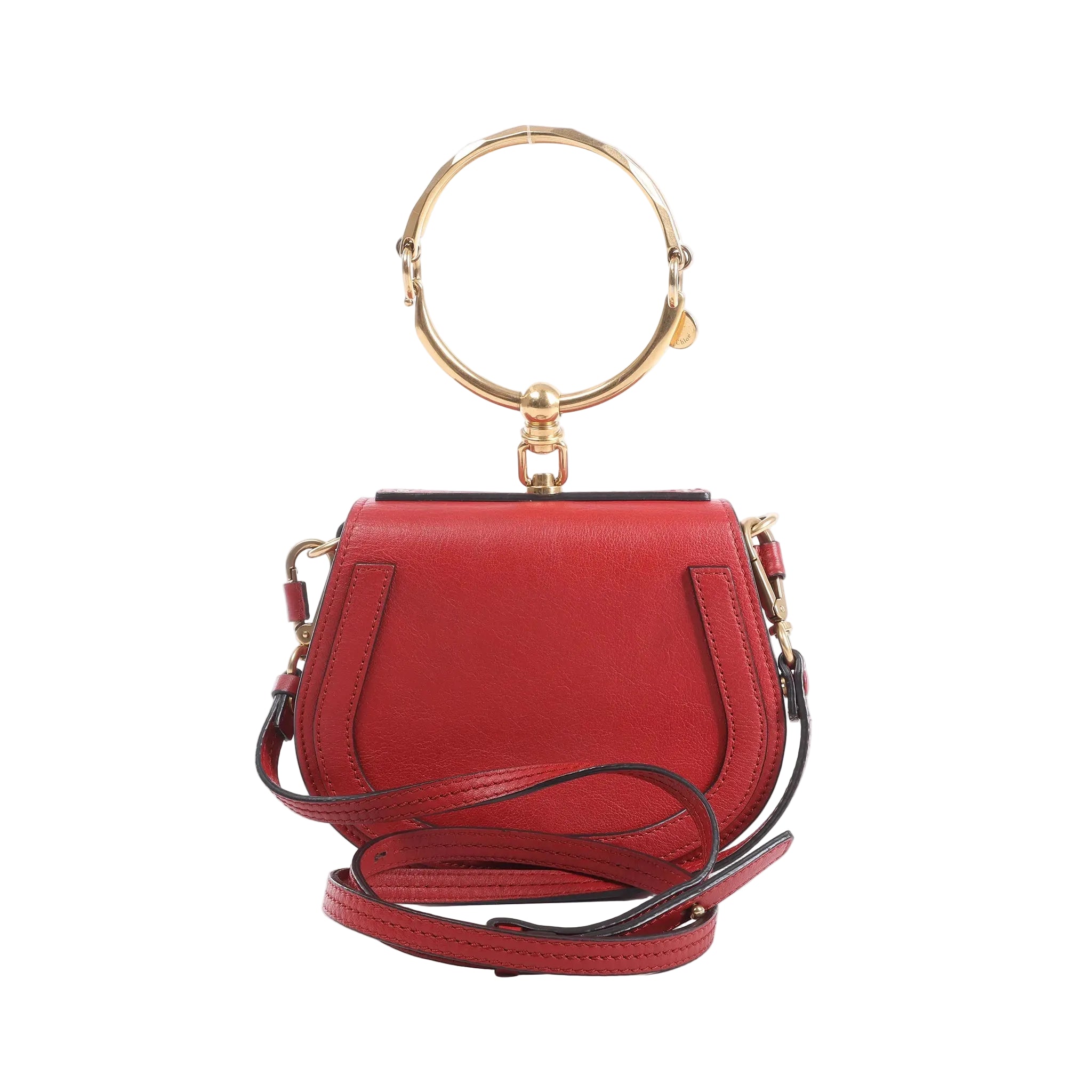 Chloé Nile Small bag in red leather with a large gold-tone bracelet handle, detachable shoulder strap and compact curved silhouette.