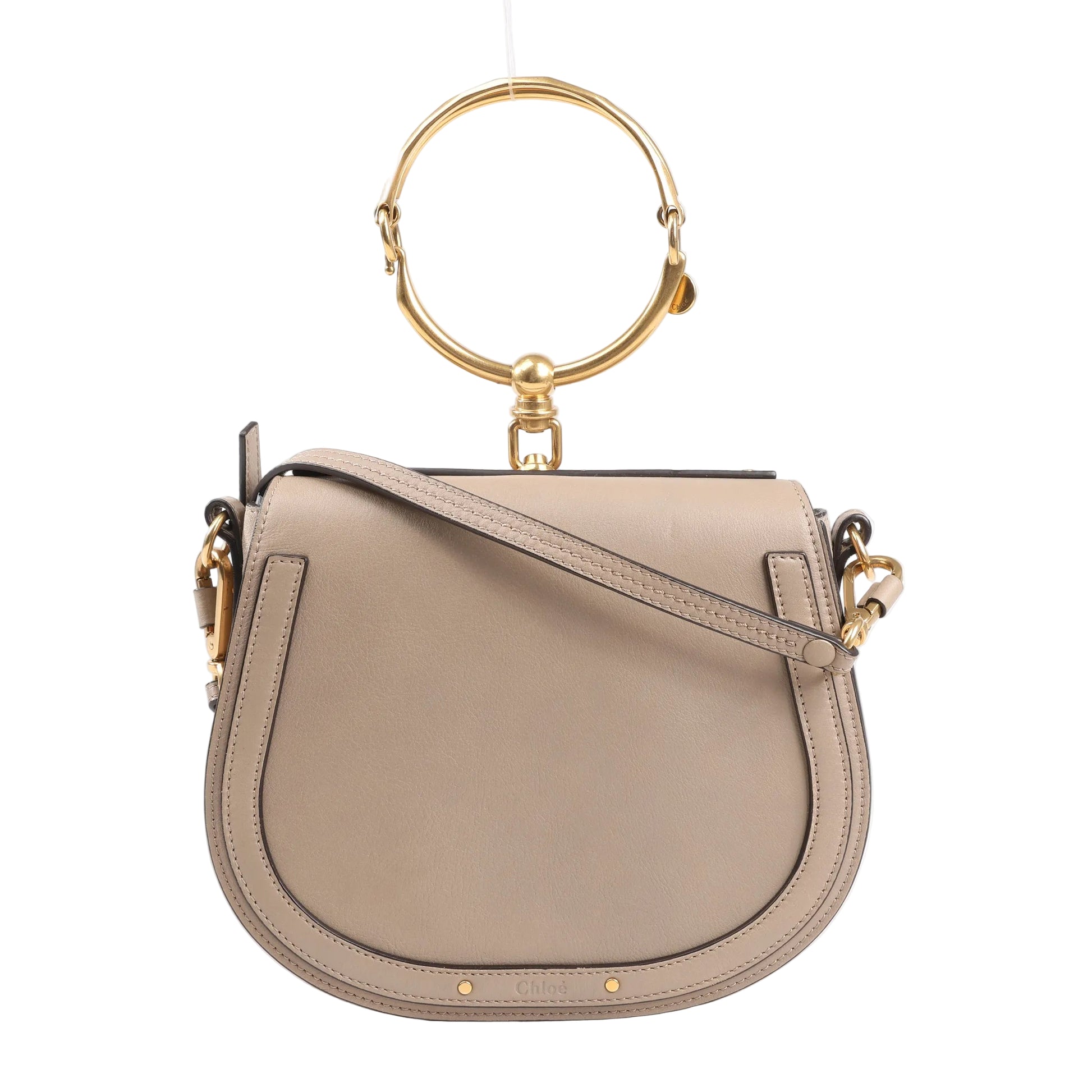 CHLOÉ Nile Small 2Way Shoulder Bag in beige leather featuring a structured saddle silhouette, gold-tone bracelet top handle, and adjustable crossbody strap.