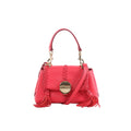 Chloé Penelope pink leather handbag with top handle, braided trim, gold-tone round clasp, tassel accents, and detachable shoulder strap, front view on white background.