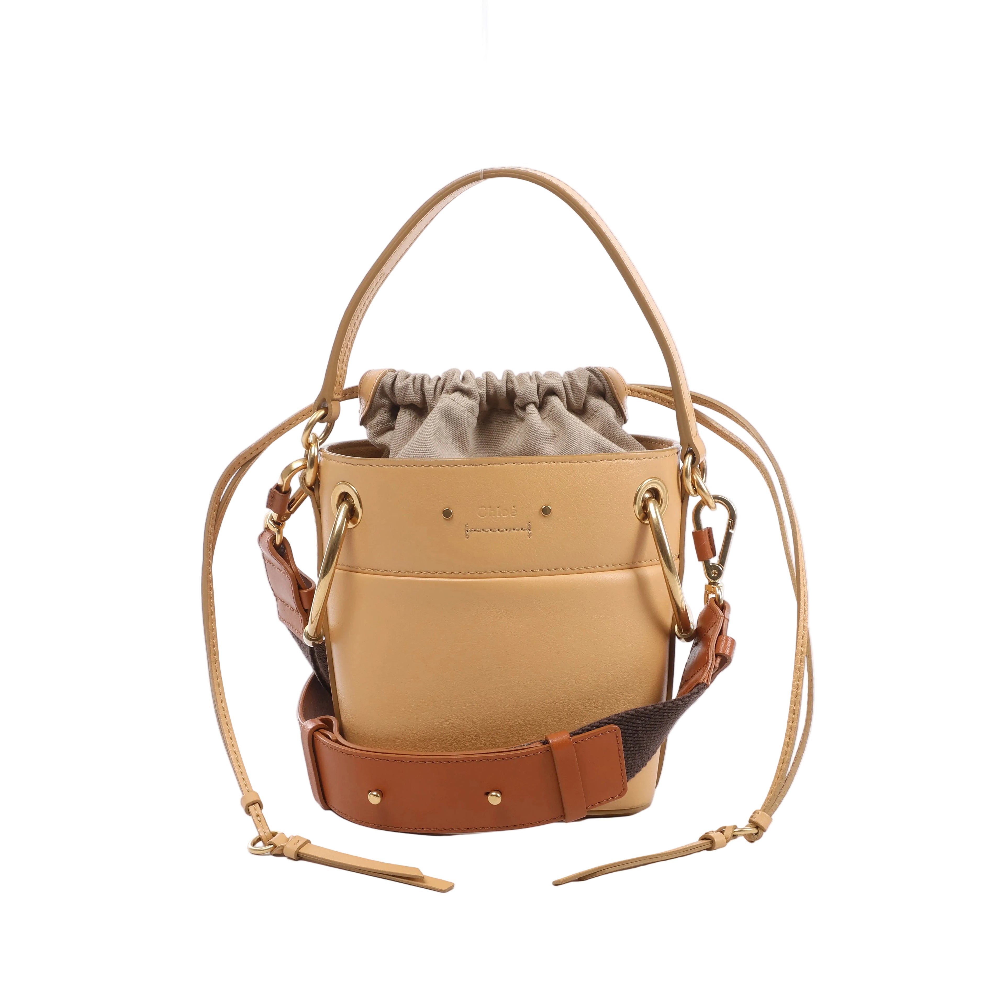 Beige Chloé Roy leather shoulder bag with gathered canvas drawstring insert, top handle, two shoulder straps and gold-tone ring hardware.