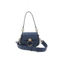 Chloé Tess Small blue leather 2-way shoulder bag with flap closure, large gold ring hardware, top handle, and wide adjustable strap on white background.
