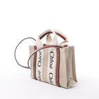 Bolso de mano de lona y piel Chloé Woody Nano de 2 vías en beige y marrón