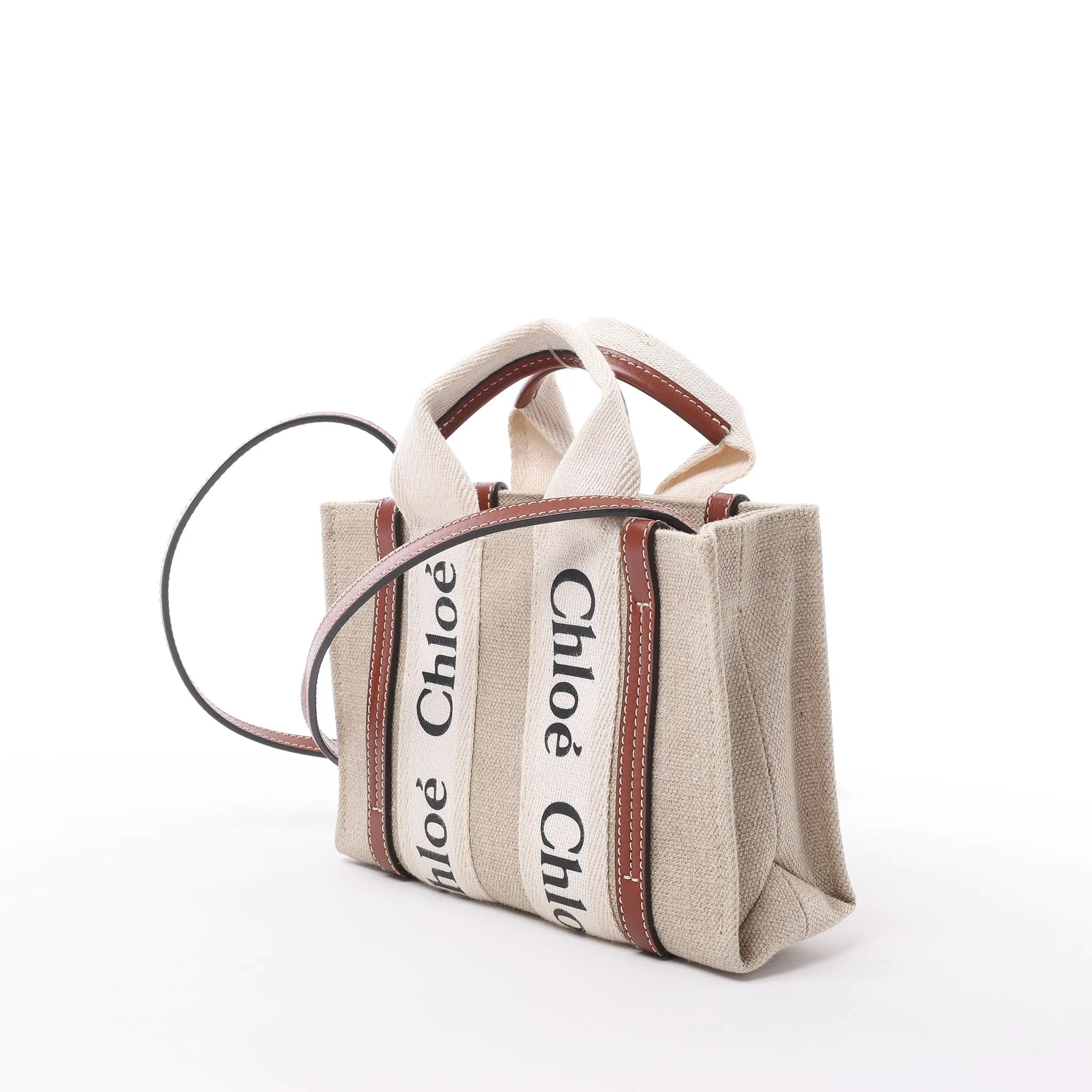 Bolso de mano de lona y piel Chloé Woody Nano de 2 vías en beige y marrón
