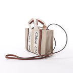 Bolso de mano de lona y piel Chloé Woody Nano de 2 vías en beige y marrón