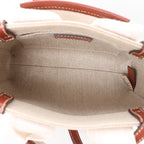 Bolso de mano de lona y piel Chloé Woody Nano de 2 vías en beige y marrón