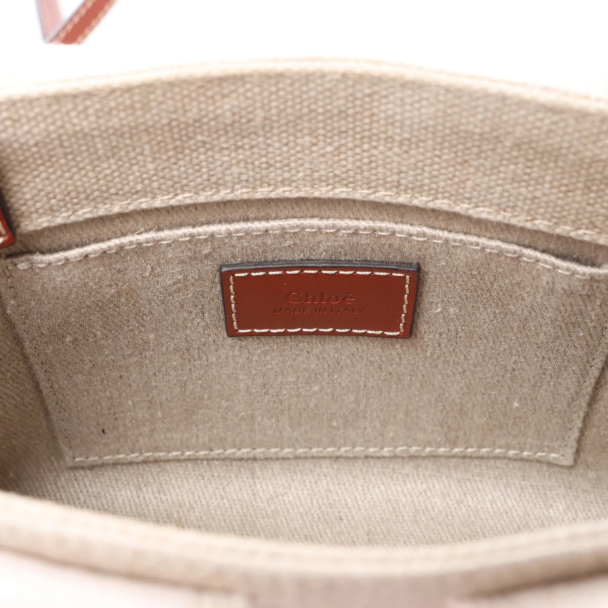 Bolso de mano de lona y piel Chloé Woody Nano de 2 vías en beige y marrón