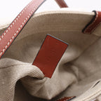 Bolso de mano de lona y piel Chloé Woody Nano de 2 vías en beige y marrón