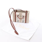 Bolso de mano de lona y piel Chloé Woody Nano de 2 vías en beige y marrón