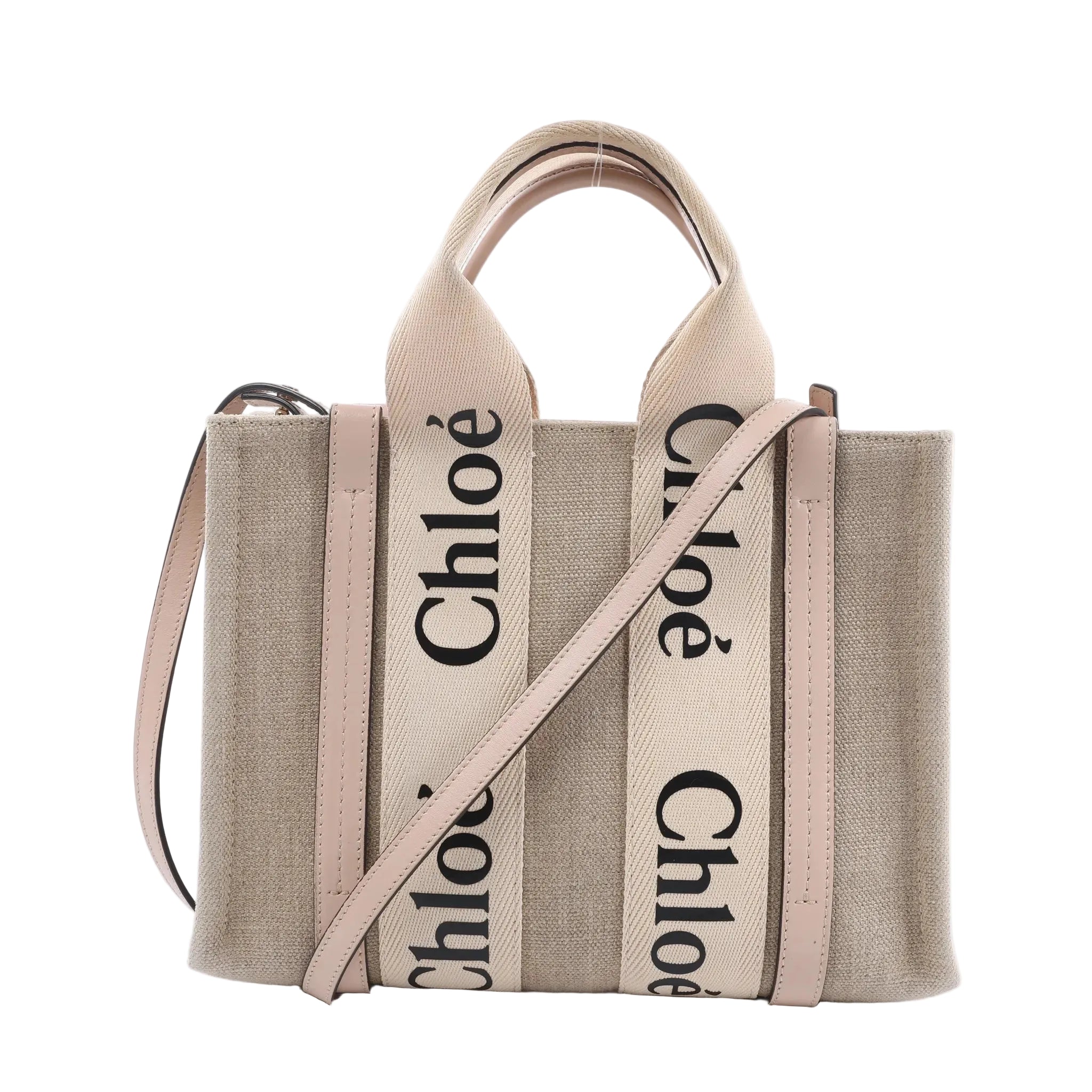 Chloé Woody Small handbag in beige canvas with pale pink leather trim, black logo webbing handles and a detachable shoulder strap.