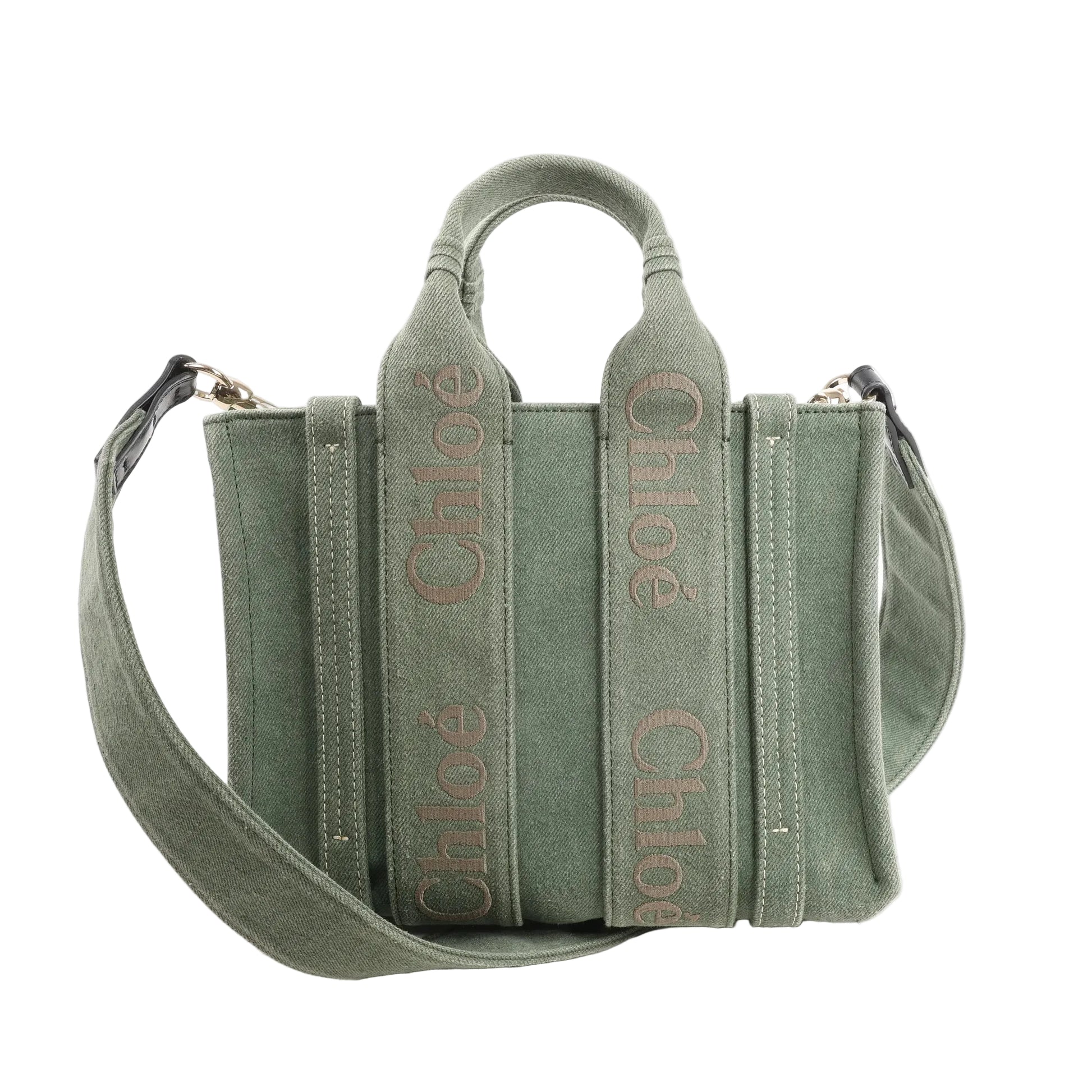 Chloé Woody Small 2Way handbag in green canvas with top handles, wide logo-embroidered vertical straps, and detachable shoulder strap.