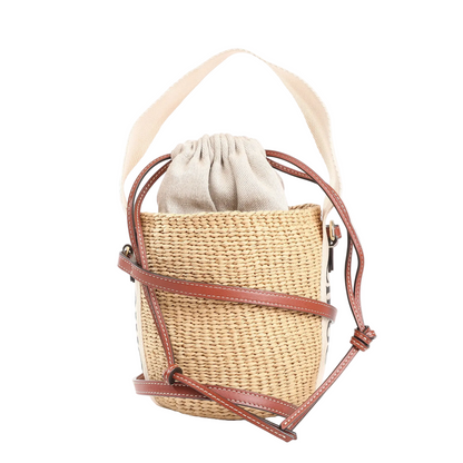 Chloé x Mifuko Sense 2-way bucket handbag in beige raffia with brown leather trim, drawstring canvas pouch, and shoulder strap.