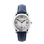 Chopard Happy Sport watch with silver dial, Roman numeral markers, floating diamond accents, stainless steel case and blue leather strap.