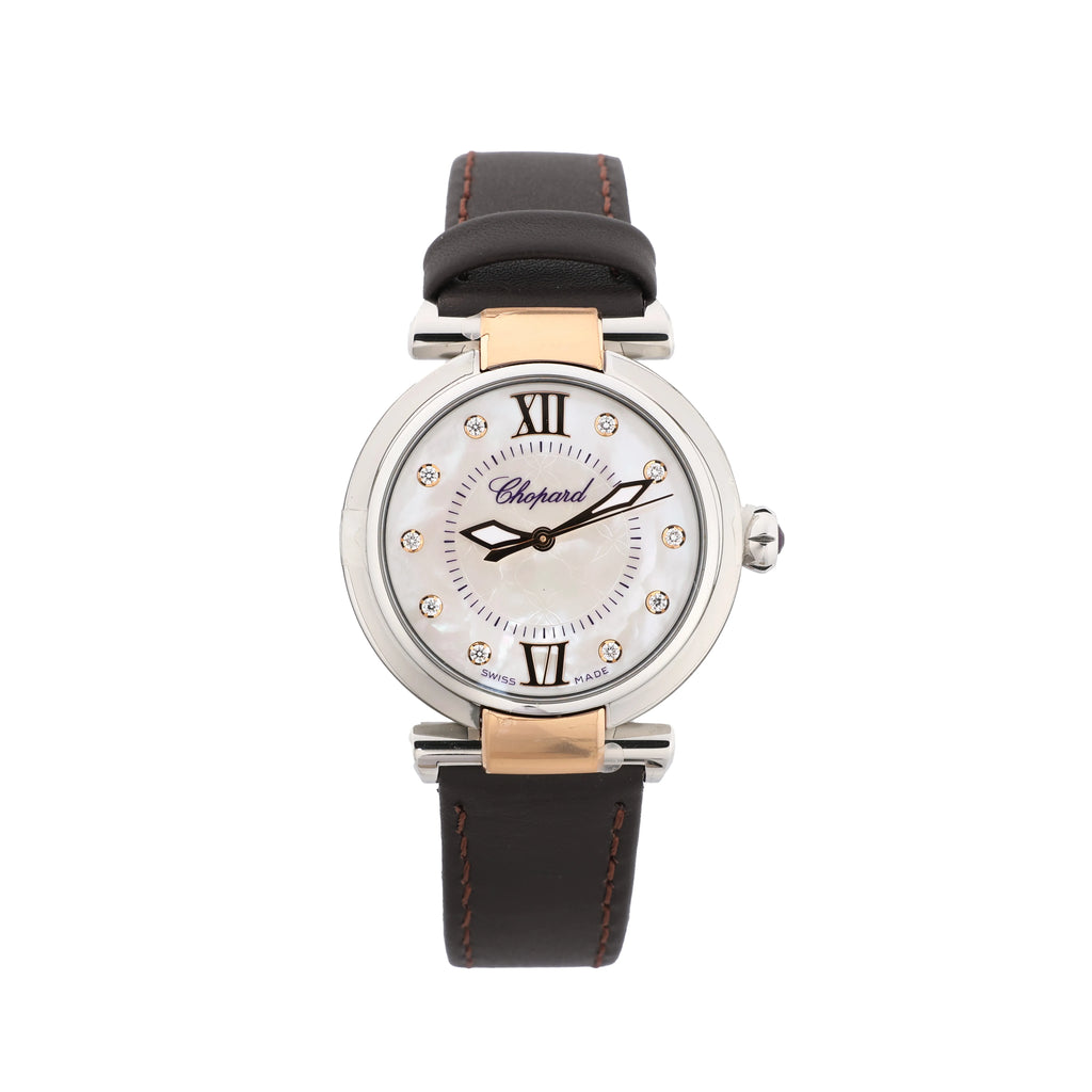 Chopard Imperiale watch with a white mother-of-pearl dial, Roman numerals, sparkling hour markers, rose gold-tone accents and a dark leather strap.