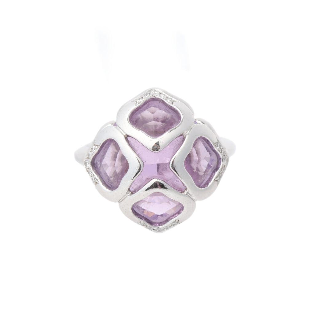 Chopard Impériale white gold ring with four cushion-cut purple amethyst stones and diamond accents on a white background