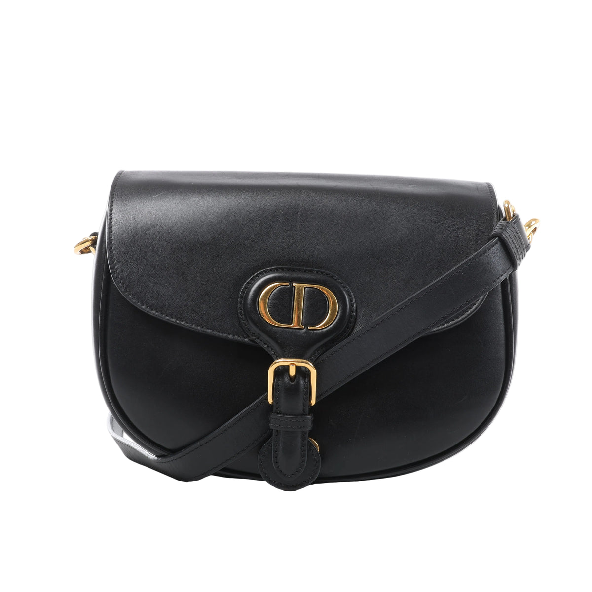 Front view of a black Christian Dior Bobby leather crossbody bag with a rounded flap, gold-tone CD initials, buckle detail and leather strap.