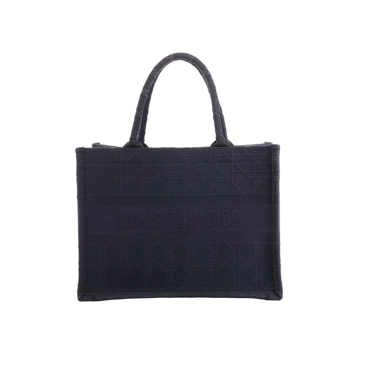 Front view of Christian Dior Book Tote in navy blue canvas with a tonal Cannage pattern, Christian Dior Paris lettering and twin handles.
