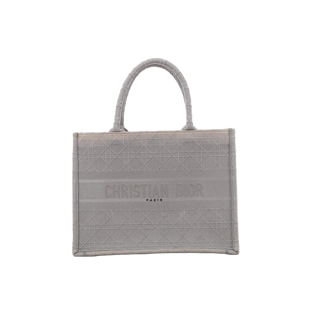 Front view of Christian Dior Book Tote Medium in gray canvas with a tonal Cannage pattern, Christian Dior Paris lettering and matching twin handles.