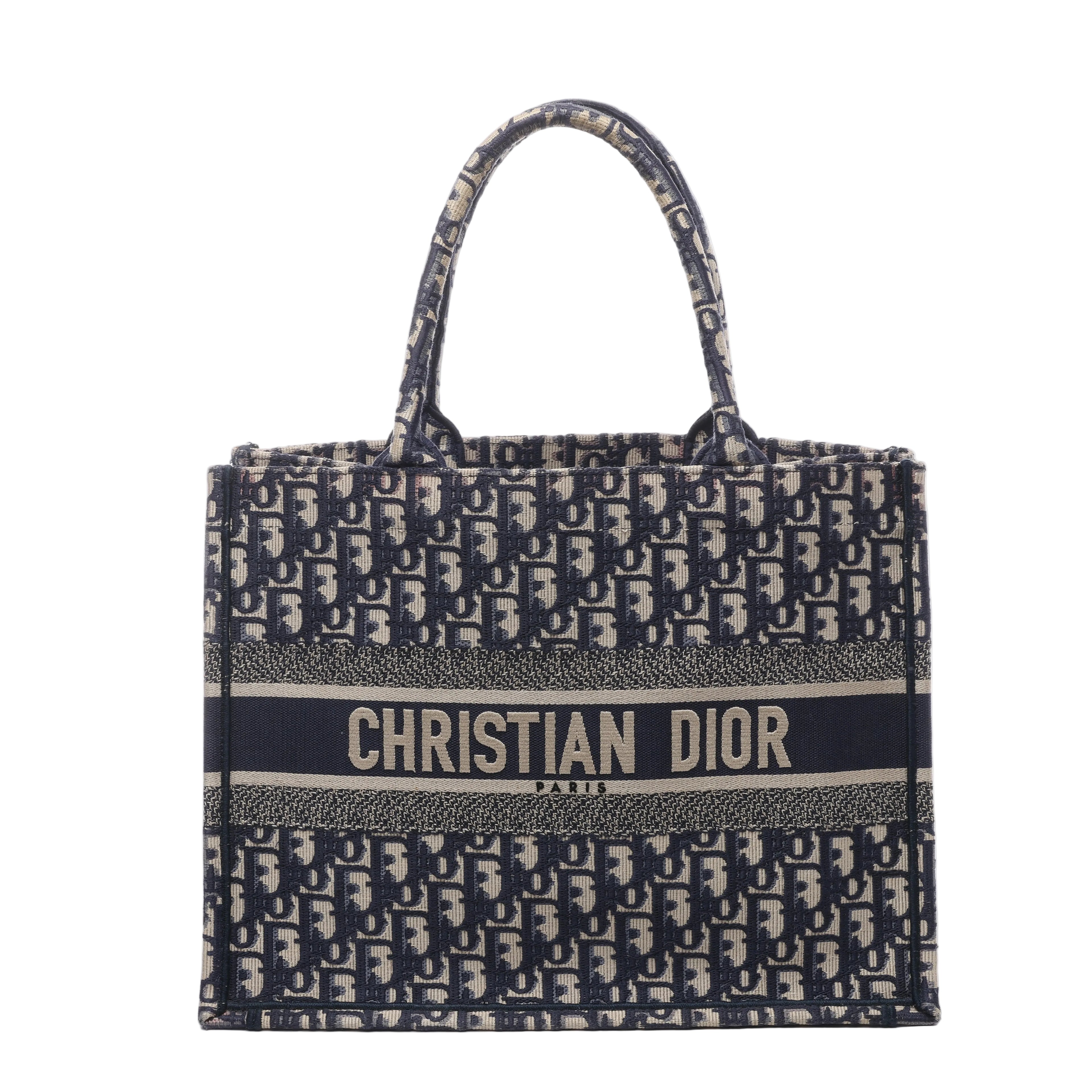 Navy and beige Christian Dior Book Tote Medium with Oblique monogram canvas, twin top handles and CHRISTIAN DIOR PARIS logo band.