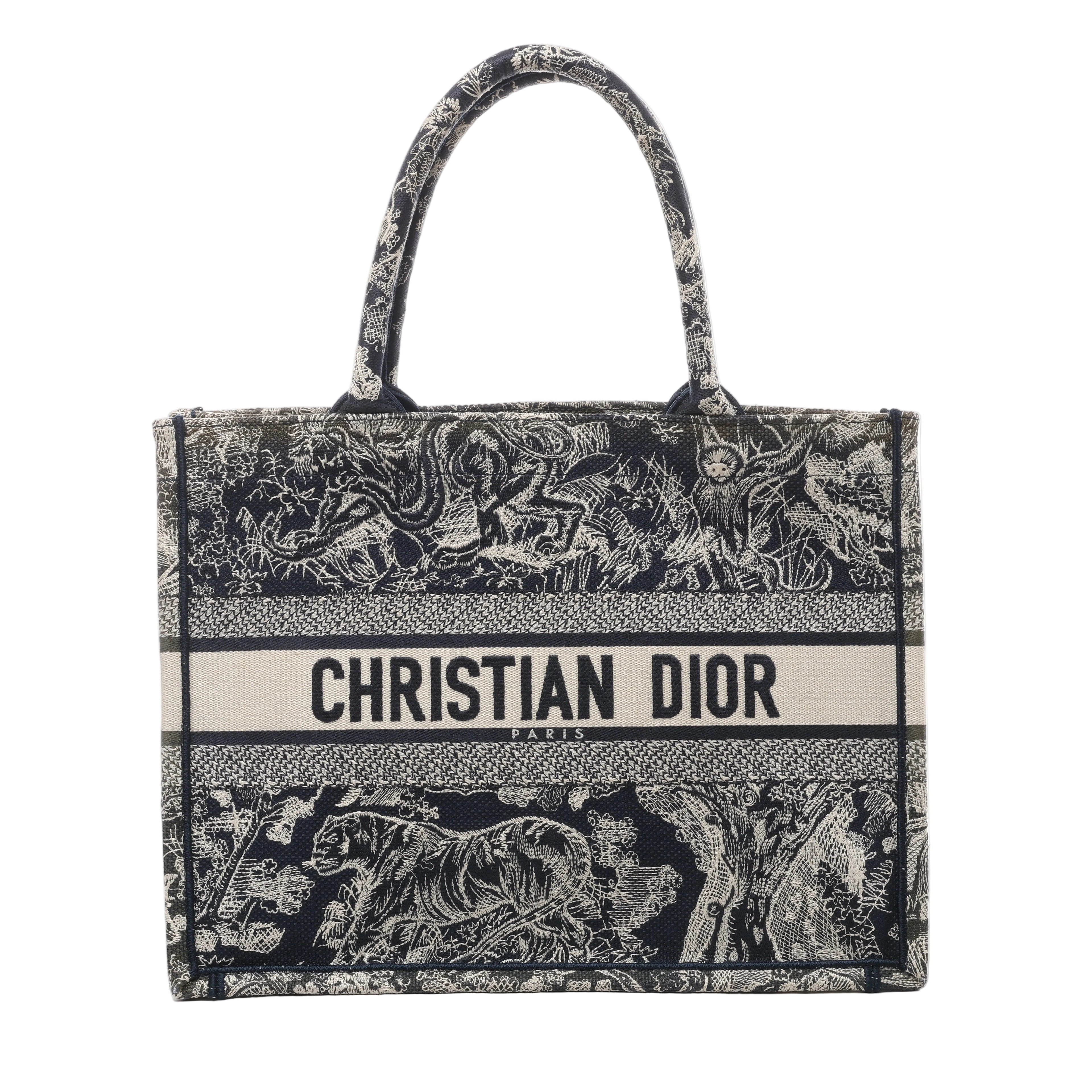 Navy blue Christian Dior Book Tote Medium with Toile de Jouy embroidered wildlife motifs, dual top handles and CHRISTIAN DIOR PARIS logo band.