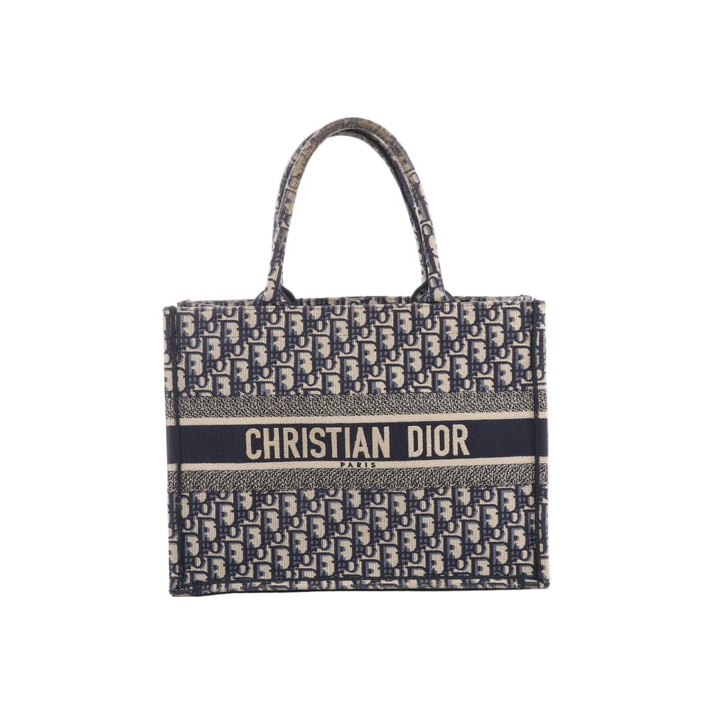 Navy blue and beige Christian Dior Book Tote with an all-over Oblique pattern, twin handles and a Christian Dior Paris signature band across the front.