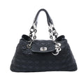 Dior Charming Lock black quilted fabric shoulder bag with silver-tone chain handles, Dior letter charms and front turn-lock flap.