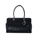 Black Christian Dior East-West Lady Dior leather bag with Cannage quilting, long top handles and silver-tone DIOR letter charms.