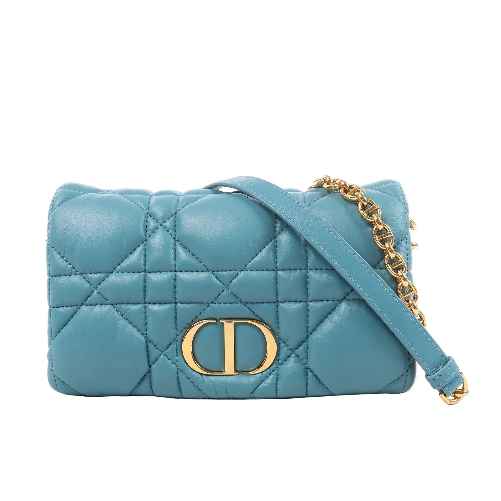 Front view of a blue Christian Dior Caro Macrocannage leather shoulder bag, featuring quilted stitching, gold-tone CD logo hardware, and a matching leather and chain strap, displayed against a white background.
