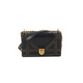 Black Dior Diorama leather shoulder bag with gold-tone studded trim, chunky chain strap, leather shoulder strap, and front clasp closure.