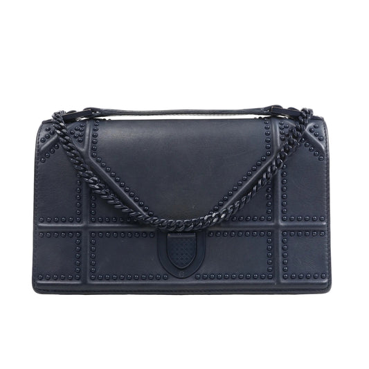 Christian Dior Diorama Chain Shoulder Bag in navy blue leather featuring geometric studded Cannage pattern, flap closure, and a dark navy chain shoulder strap, displayed on a white background.