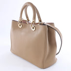 Bolso de mano mediano de dos vías de piel Cannage de Christian Dior en color camello