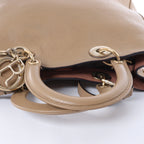 Bolso de mano mediano de dos vías de piel Cannage de Christian Dior en color camello