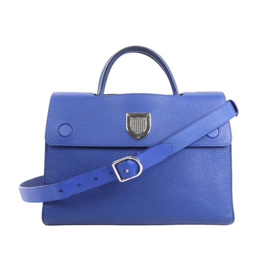 Blue handbag with a silver clasp on a white background