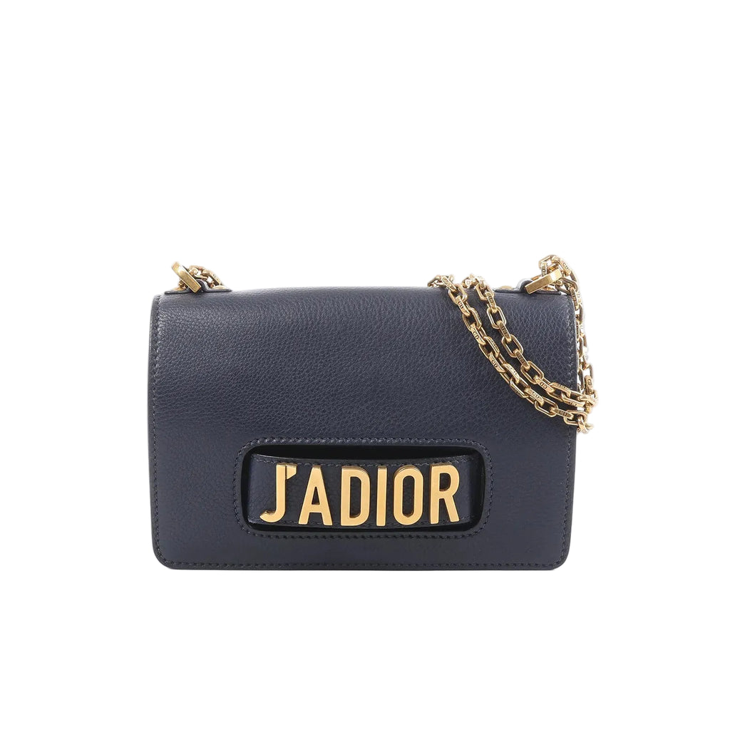 Dior J’Adior navy grained leather crossbody bag with gold-tone chain strap and large gold “J’ADIOR” logo on the front flap.
