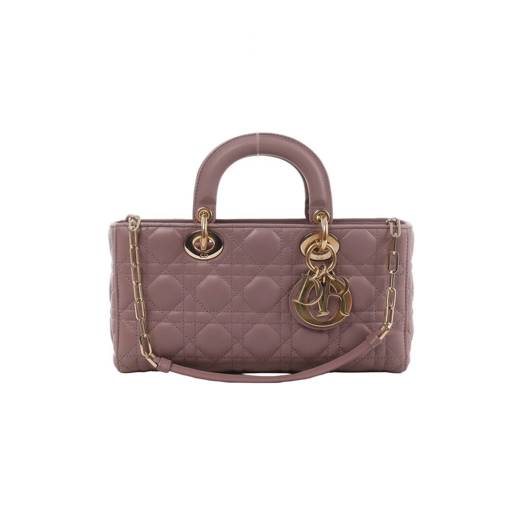 Pink Dior Lady D-Joy quilted leather handbag with rounded top handle, gold-tone DIOR charms and chain-and-leather shoulder strap.