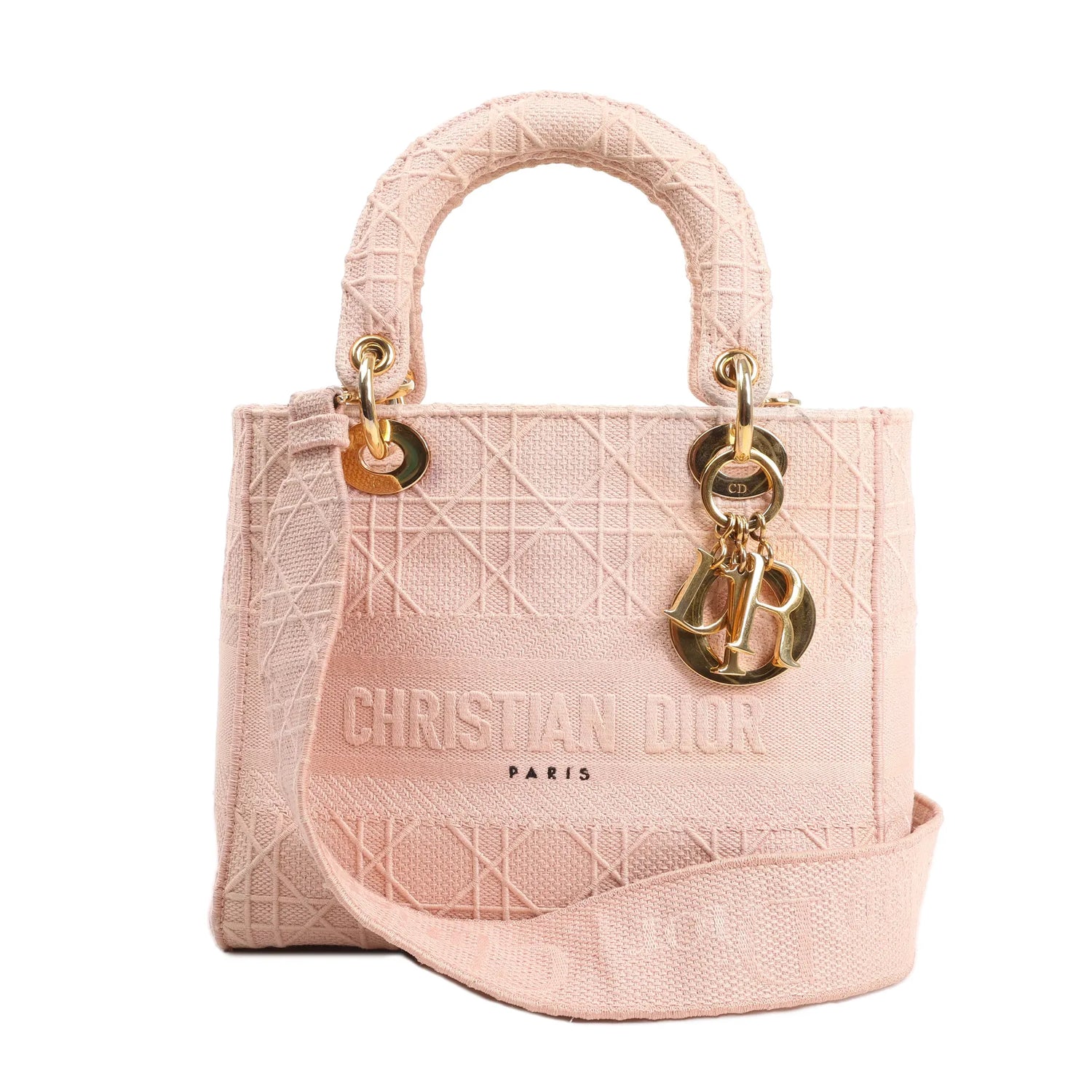 Christian Dior Lady D-Lite Medium handbag in light pink Cannage-embroidered canvas, featuring top handles, detachable strap, and gold-tone “D.I.O.R.” letter charms.