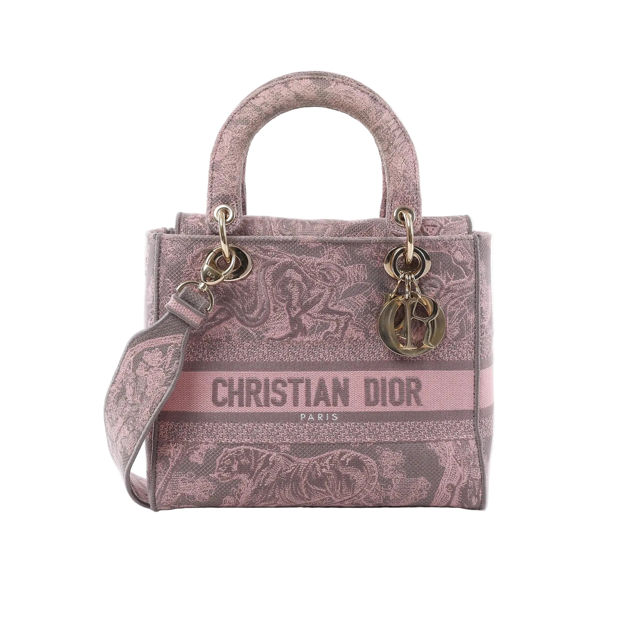 Dior Lady D-Lite Medium pink Toile de Jouy embroidered canvas handbag with top handles, shoulder strap, CHRISTIAN DIOR front logo, and gold-tone DIOR charms on white background.