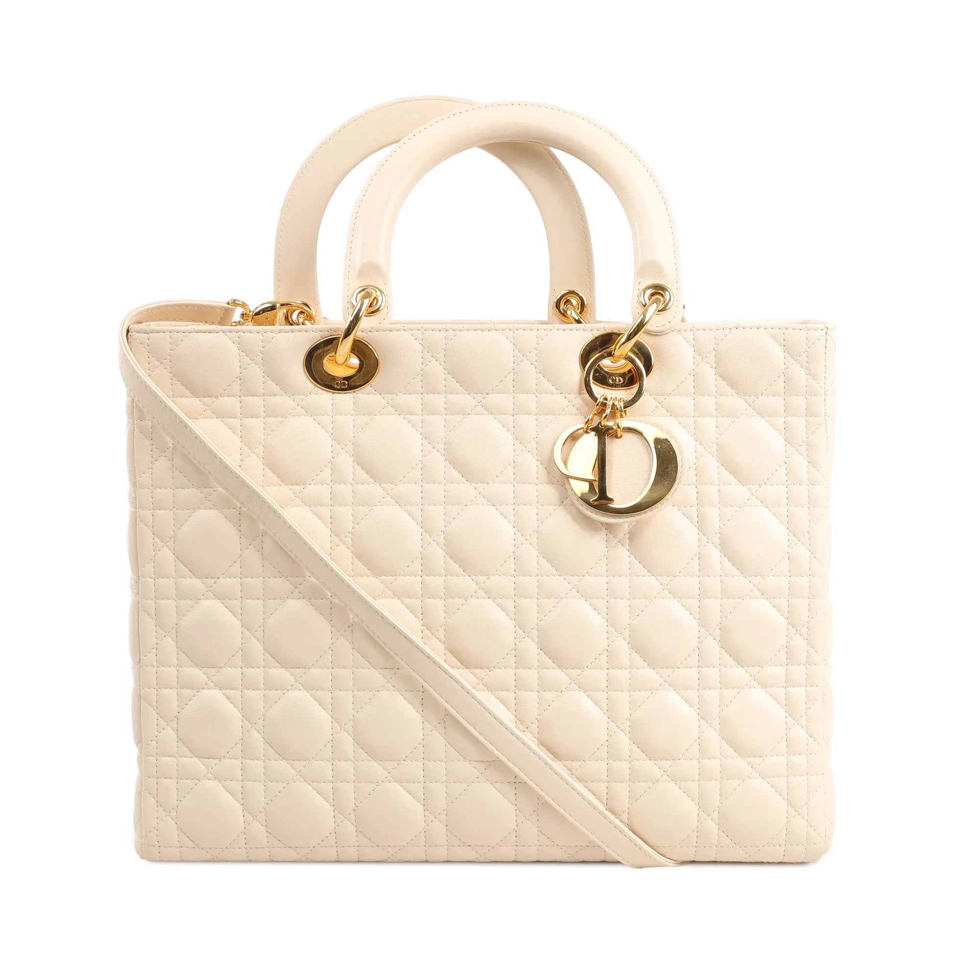 Dior Lady Dior large handbag in beige leather featuring signature Cannage quilting, gold-tone hardware, top handles, and iconic "Dior" letter charms.