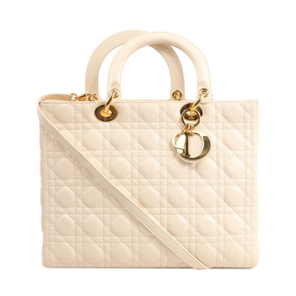 Dior Lady Dior large handbag in beige leather featuring signature Cannage quilting, gold-tone hardware, top handles, and iconic "Dior" letter charms.