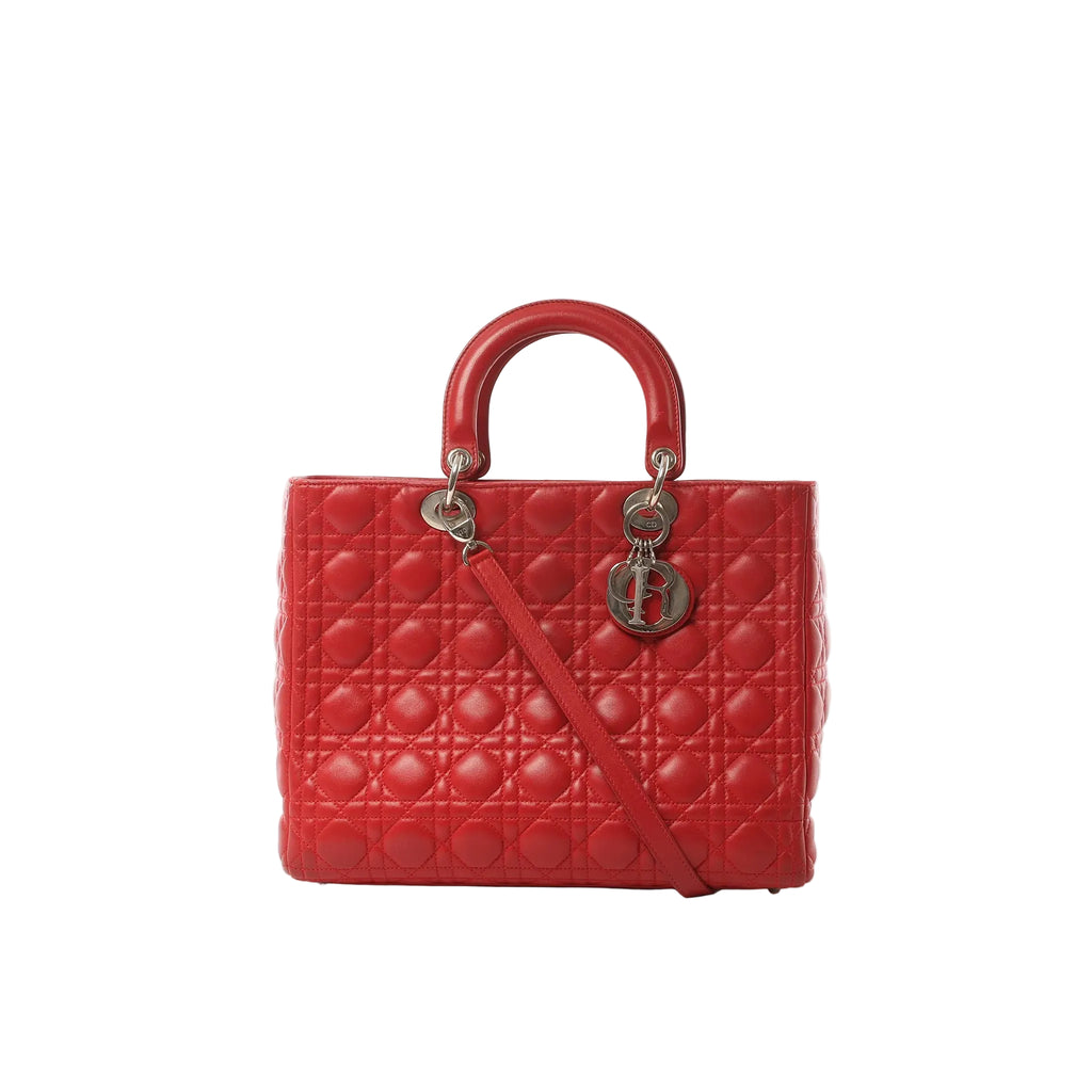 Red Dior Lady Dior large leather bag with Cannage quilting, round top handles, shoulder strap, and hanging Dior letter charms
