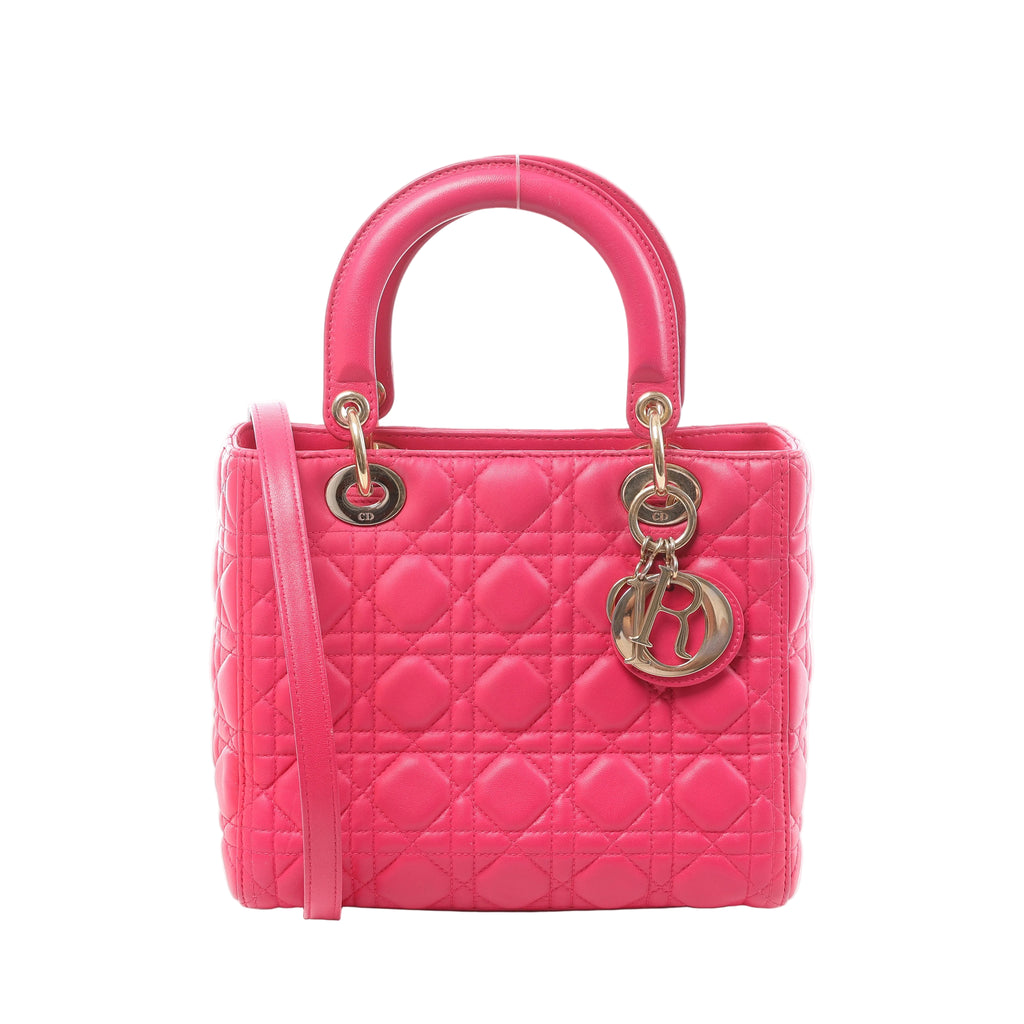 Pink Christian Dior Lady Dior Medium Cannage leather handbag with dual top handles, slim shoulder strap and gold-tone DIOR charms.