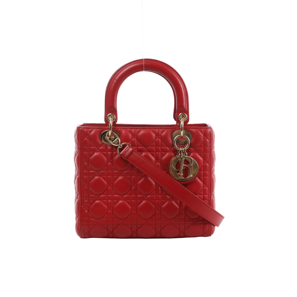 Red Dior Lady Dior Cannage-quilted leather handbag with rounded top handles, shoulder strap and gold-tone DIOR letter charms.