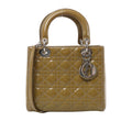 Khaki Christian Dior Lady Dior patent leather handbag with Cannage quilting, rounded handles, a matching shoulder strap and silver-tone Dior charms.